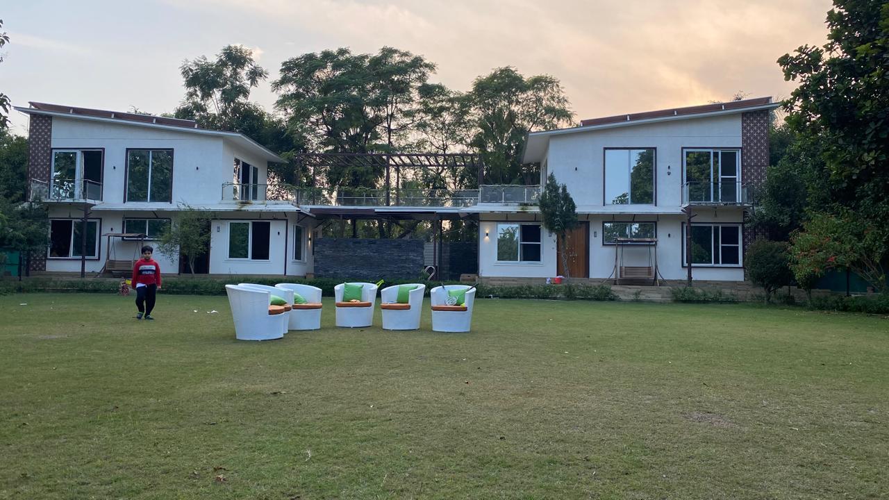 Cottages at dusk with garden seating