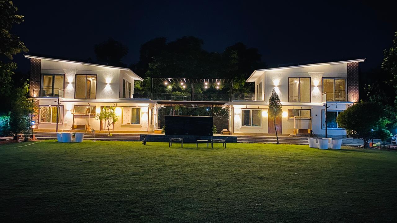 Twin cottages beautifully lit at night
