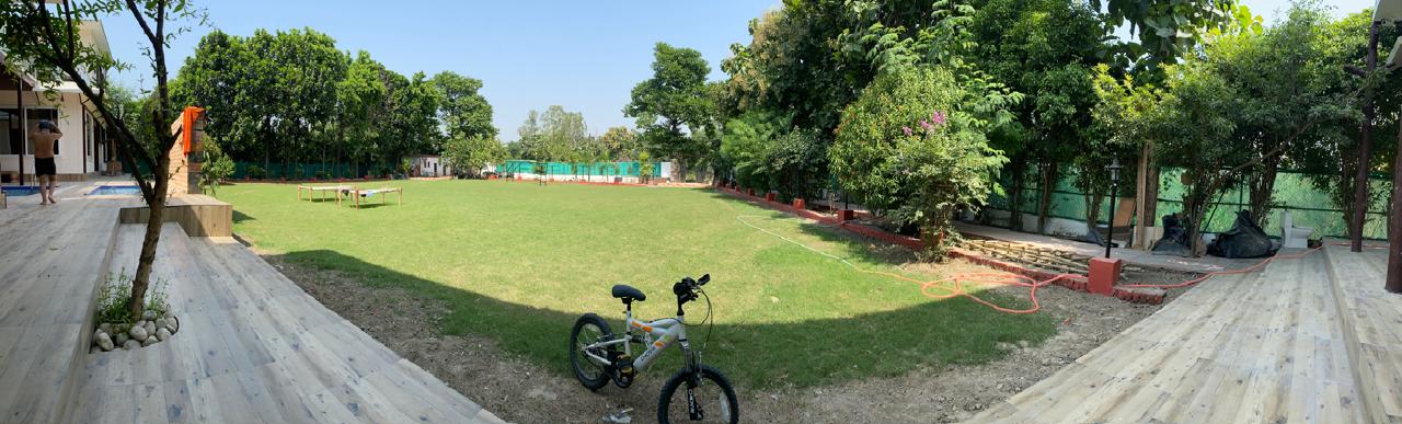 Panoramic view of lawn and cottages