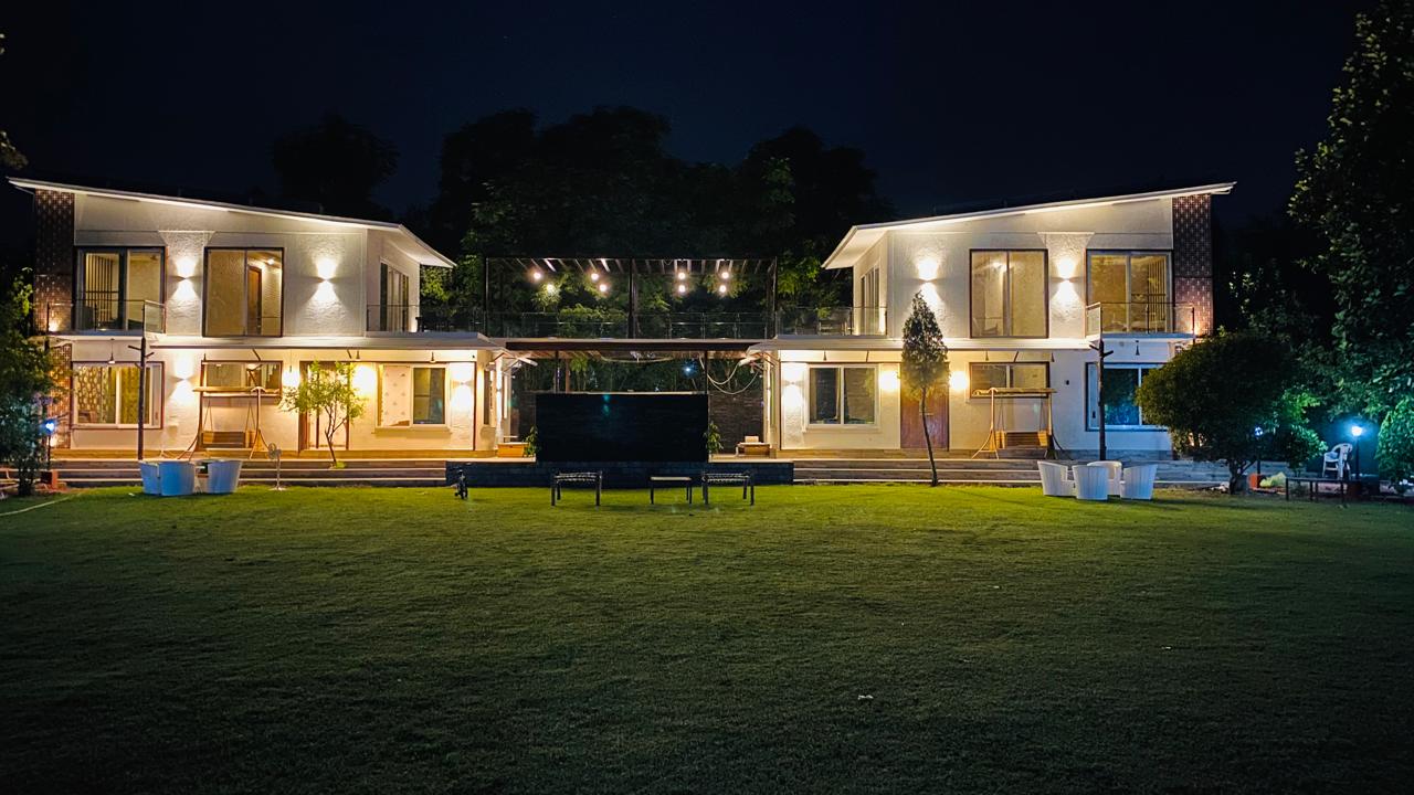 Twin cottages glowing at night