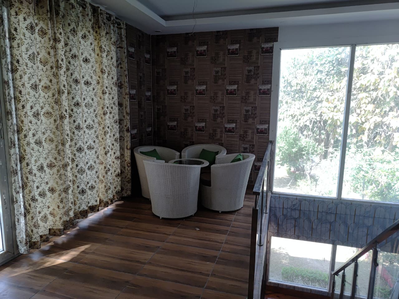 Upper level lounge with white wicker seating